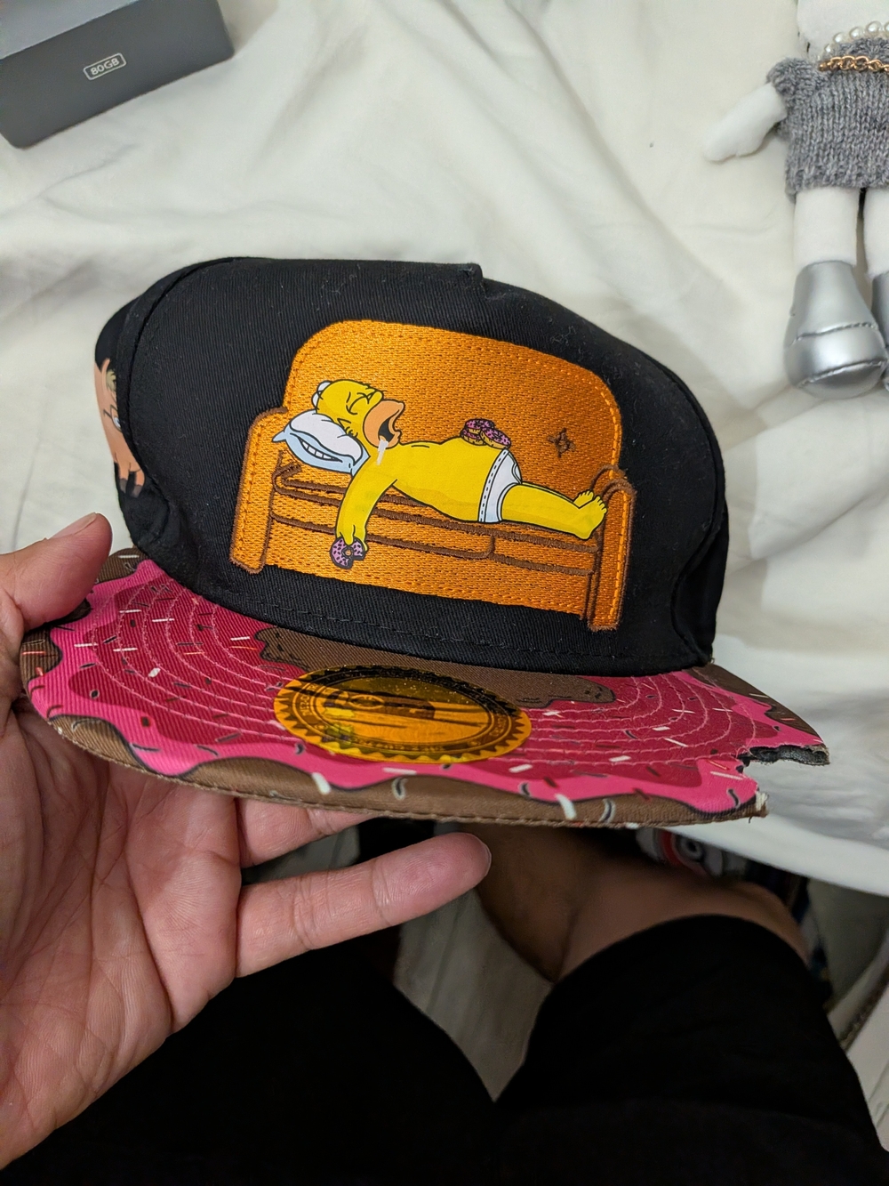 Simpsons Black Snapback Cap with Cartoon Couch Graphic and Pink Brim